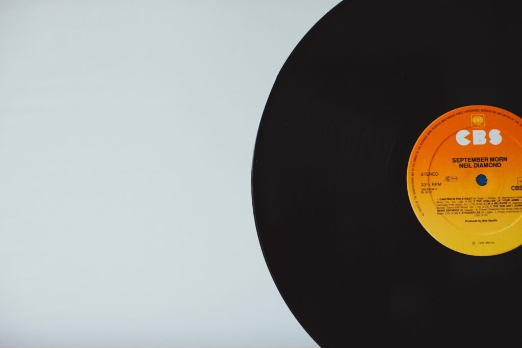 A close-up of a vintage vinyl record with CBS label on a white background.